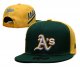 Oakland Athletics's green and yellow cap